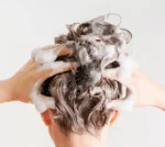 woman with herbalife aloe shampoo hair